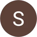 Icône de la lettre "S" dans un cercle marron foncé.