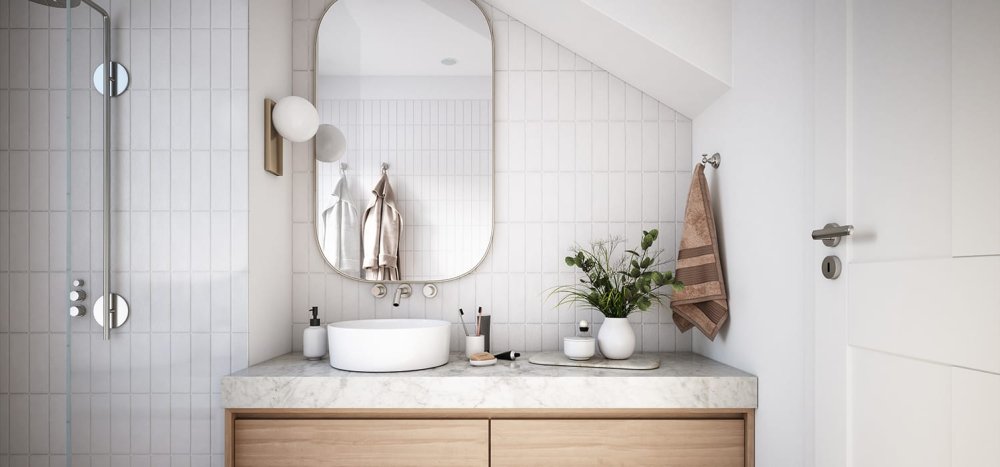 Salle de bain moderne avec vasque ronde blanche, miroir arrondi, meuble en bois clair et mur carrelé blanc